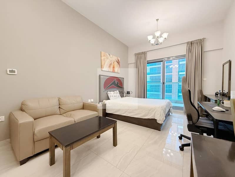 Furnished studio with pool and water views, photo 1